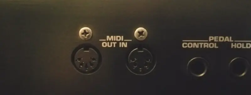 Photo of the 5-pin DIN MIDI ports on a music keyboard