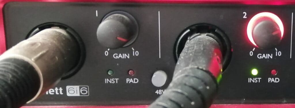 Photo of Focusrite audio interface showing one of the inputs clipping