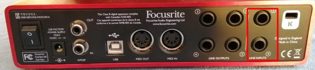 Photo of a Focusrite Scarlett 6i6 interface with its stereo line inputs highlighted in red